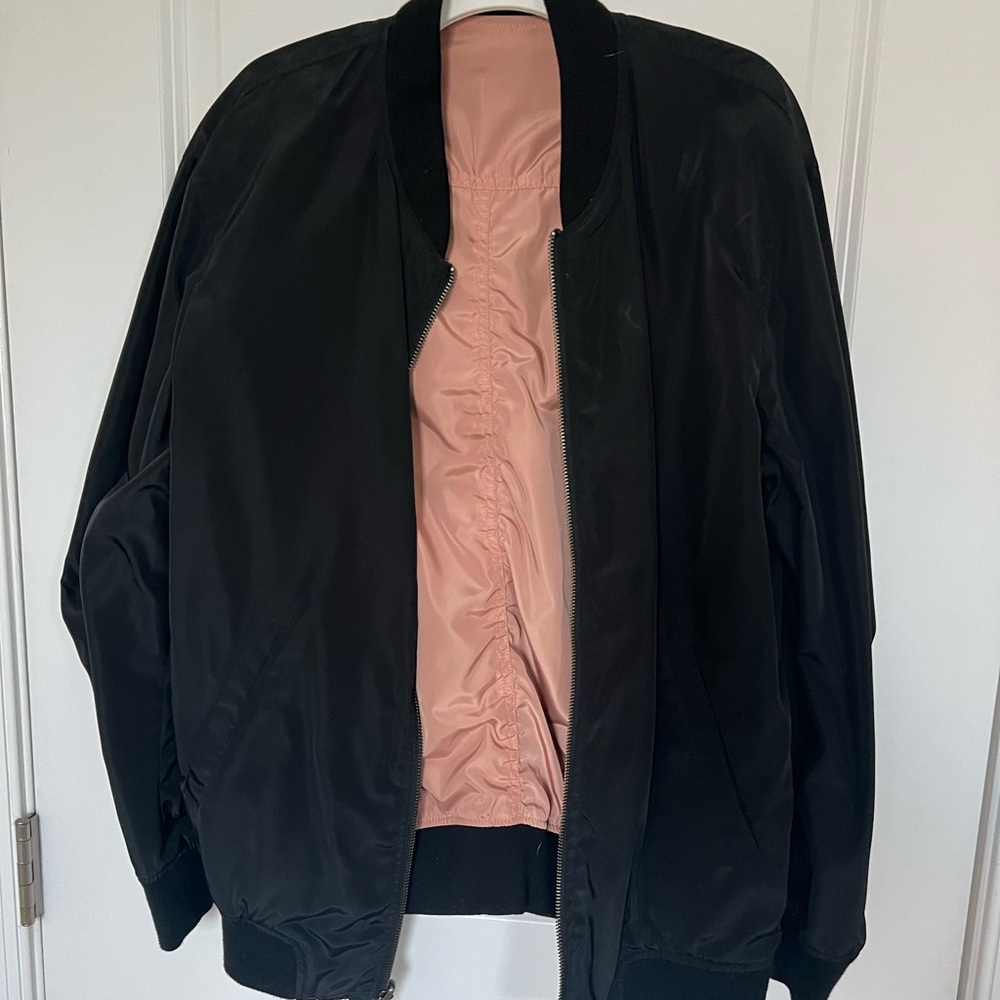 Urban Outfitters reversible black and pink bomber jacket